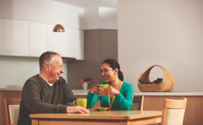 Two people talking over a cup of tea.