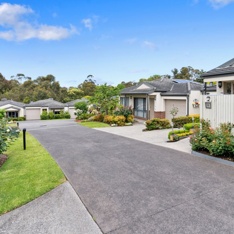 Modern retirement community with landscaped gardens and contemporary homes